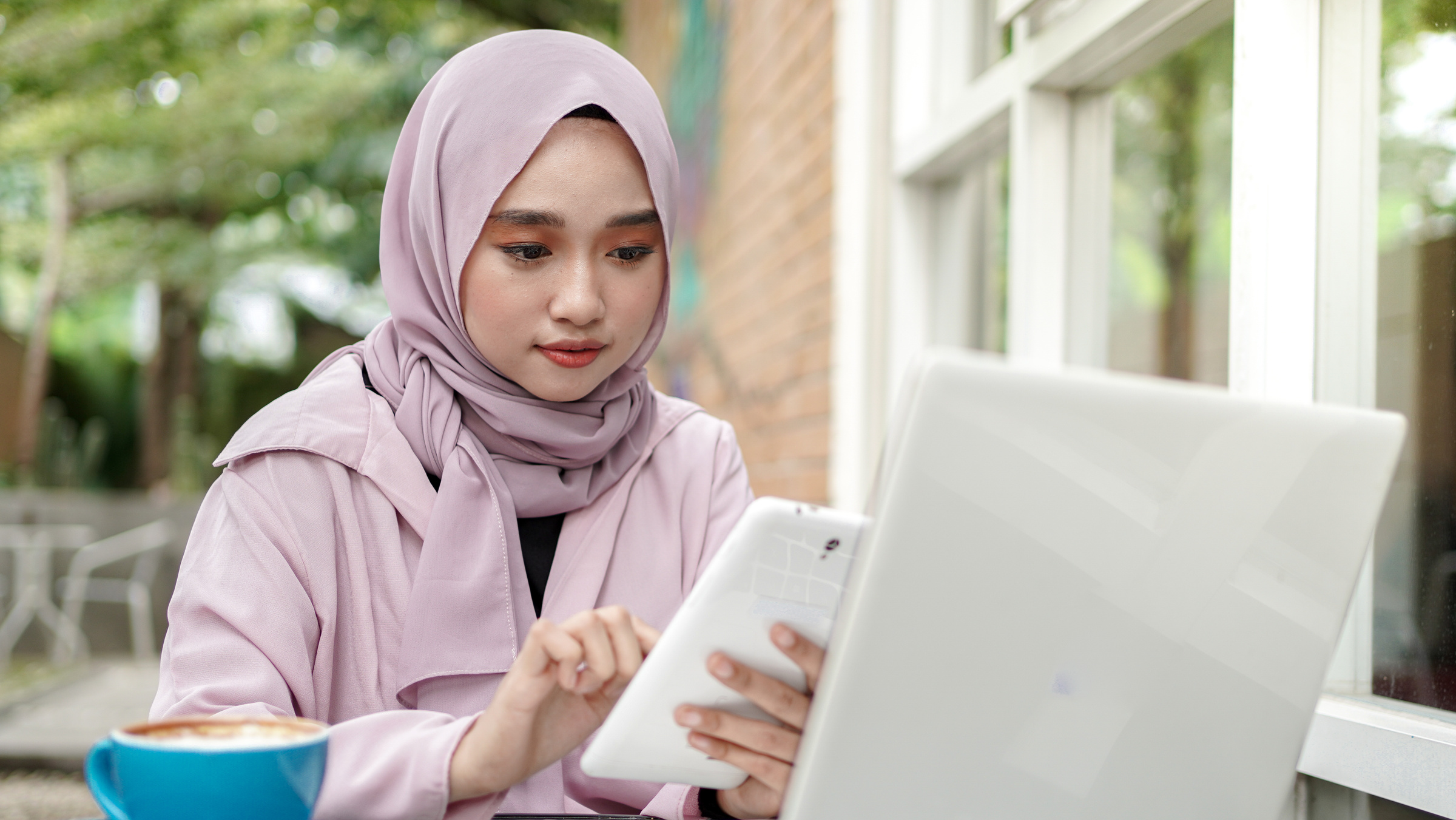 Woman Wearing Hijab Working Outdoors 